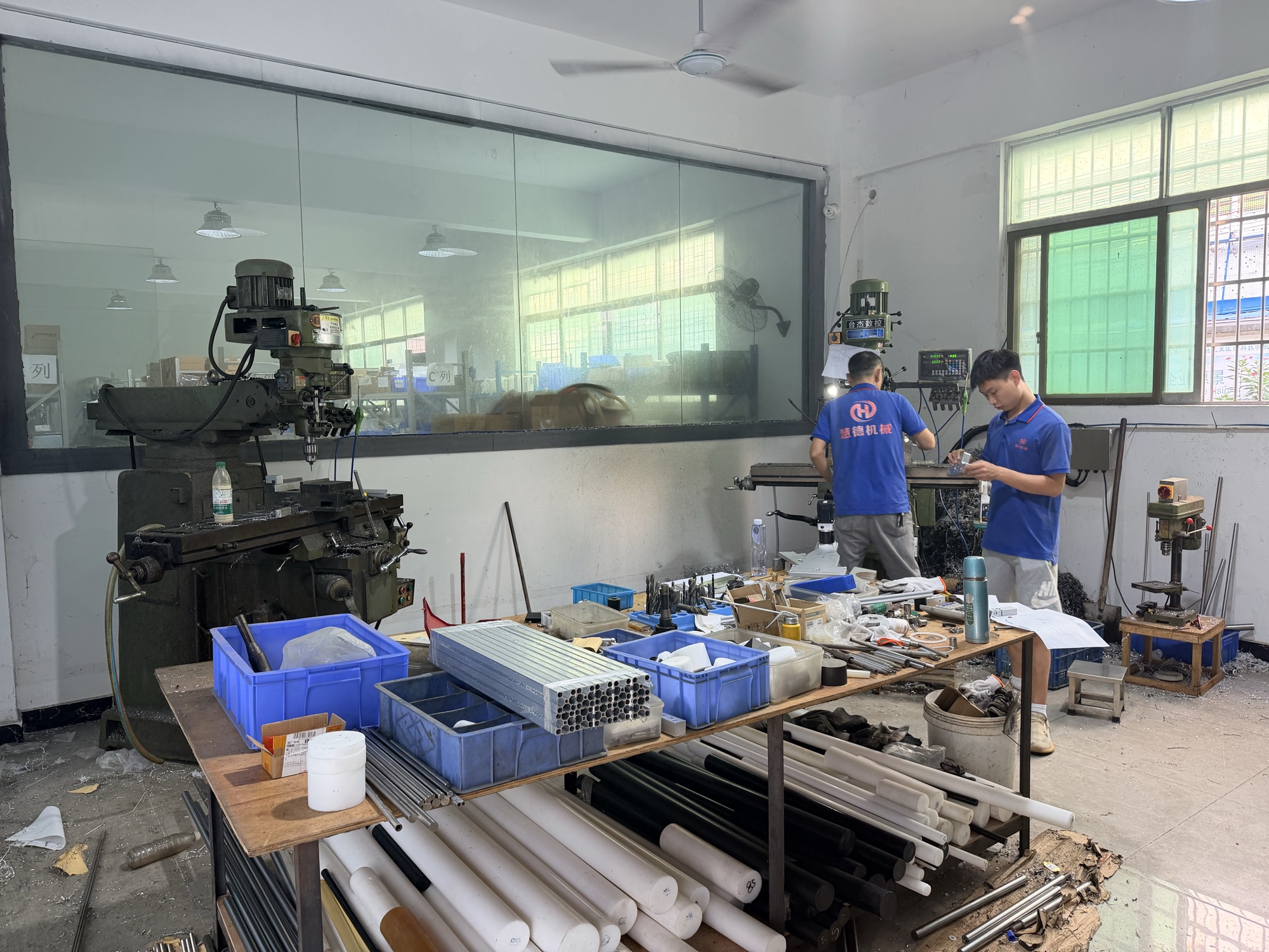 Team members at work in the Huide workshop